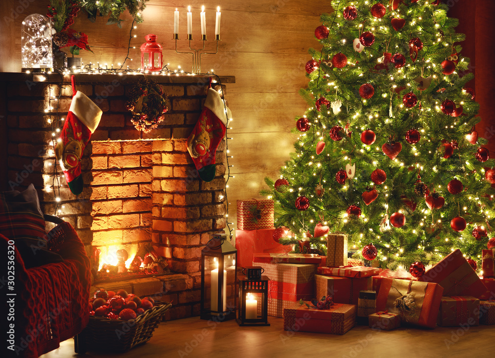 interior christmas. magic glowing tree, fireplace, gifts in  dark  . - obrazy, fototapety, plakaty 