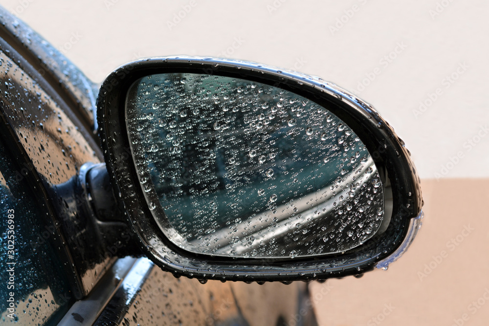 Car side mirror with raindrops. Car side mirror with raindrops.