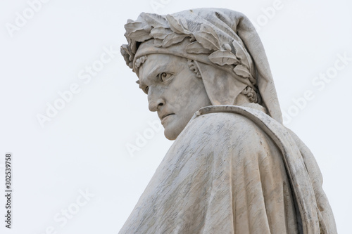 Dante Alighieri statue in florence, italy, close up. Italian writter