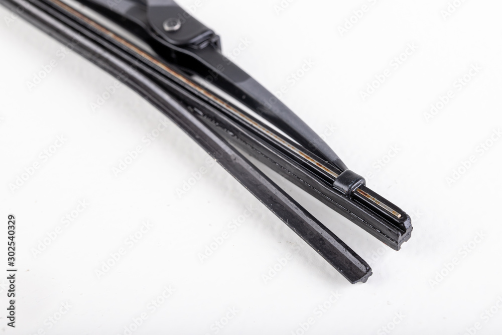 Old worn car wiper blade. Car accessories. Old worn car wiper blade. Car accessories.
