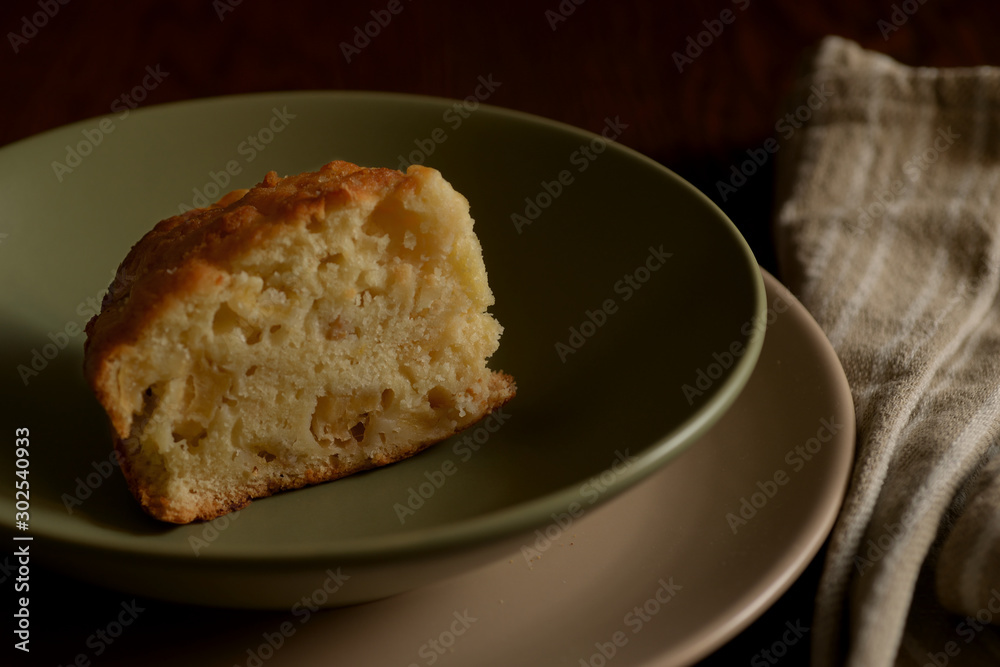 Slice of mouth watering rustic apple pie served on dish