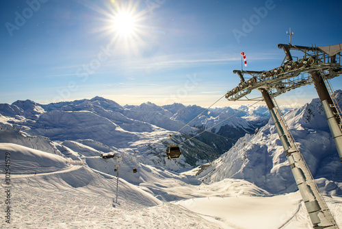 Alpin winter landscape at the arlberg with slopes and an chairlift  © Felix