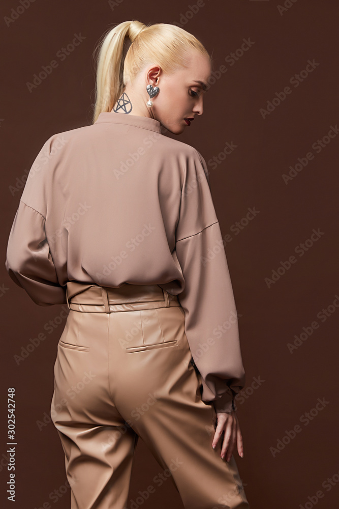 Sexy beautiful business woman lady boss CEO manager makeup long curly hair blond wear clothes office dress code suit jacket pants uniform work or date catalog accessory jewelry elegant style. Stock Photo | Sexy beautiful business woman lady boss CEO manager makeup long curly hair blond wear clothes office dress code suit jacket pants uniform work or date catalog accessory jewelry elegant style. Stock Photo |