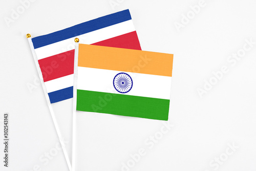India and Costa Rica stick flags on white background. High quality fabric, miniature national flag. Peaceful global concept.White floor for copy space.