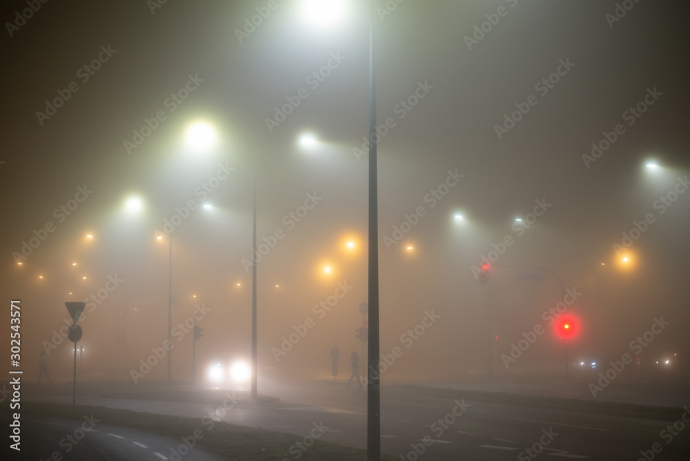 Fog at night in the empty city streets