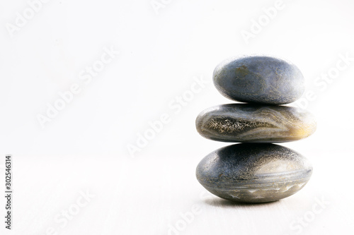 Pile of stones isolated on white background, Stones for massage and zen lifestyle. Mystic stones in balance.