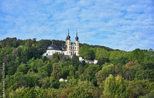 Hillside Church with Onion Dome Bell Towers among Forest