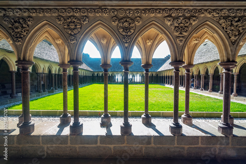Cloister of the abbey of Mont Saint Michael formed by a succession of columns and arches. photo