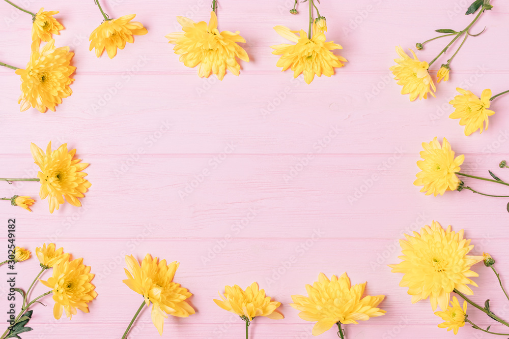 Fototapeta premium Spring flat lay frame composition of fresh yellow flowers