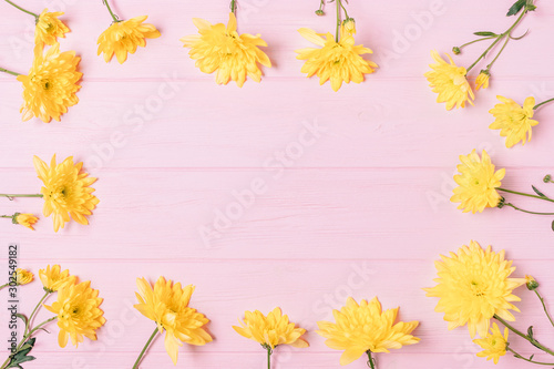 Spring flat lay frame composition of fresh yellow flowers