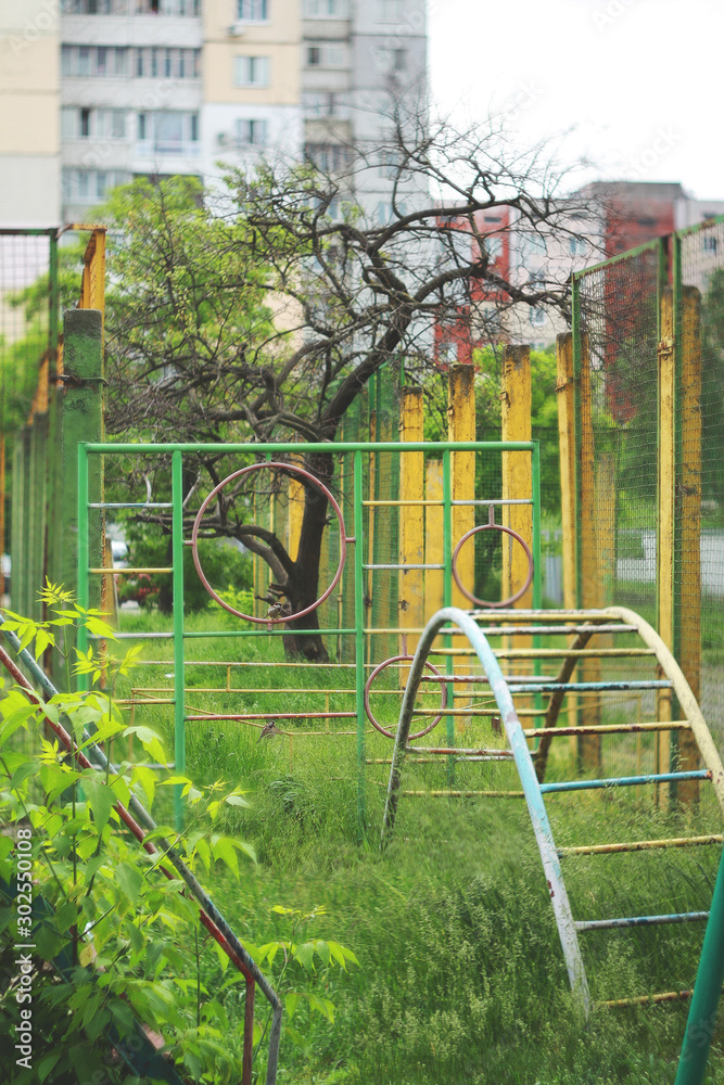 Fototapeta premium Playground overgrown with plants