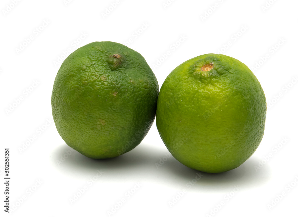 Two limes isolated on white.