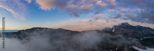 colorful sunset sky panorama with clouds and mountains at austria pinswang