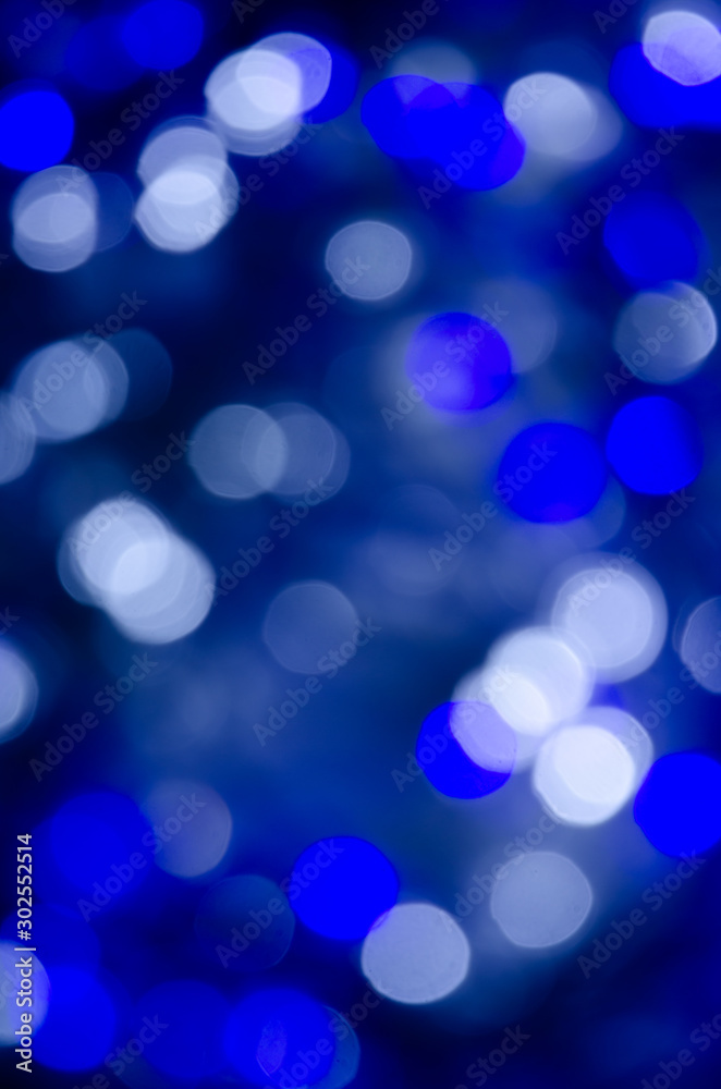 Abstract bokeh of blue and white lights on a dark background Abstract bokeh of blue and white lights on a dark background