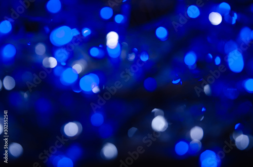 Abstract pattern of bokeh garland lights on a dark background