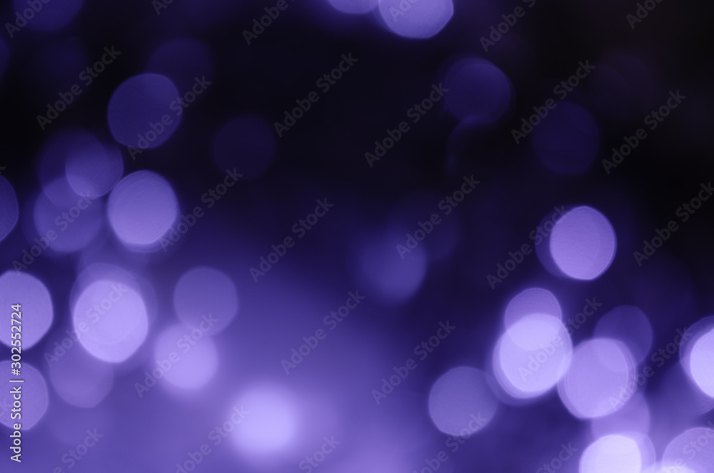 Abstract bokeh of purple lights on a dark background Abstract bokeh of purple lights on a dark background