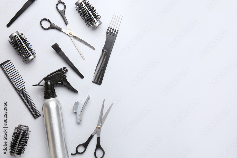 Set of hairdresser tools and accessories on light background Set of hairdresser tools and accessories on light background