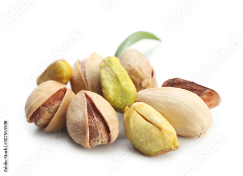 Tasty pistachio nuts isolated on white