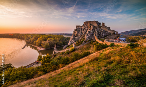 Famous Devin Castle Ruin Located at Confluence of Danube River and Morava River near Bratislava, Slovakia at Sunset