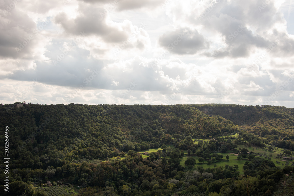 Green Tuscany landscape under cloudy sky near Bagnoregio, Viterbo, Italy. Green Tuscany landscape under cloudy sky near Bagnoregio, Viterbo, Italy.