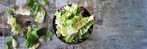 Mix of salads in a bowl. Green juicy lettuce leaves. The concept of a healthy diet. Selective focus. Macro.