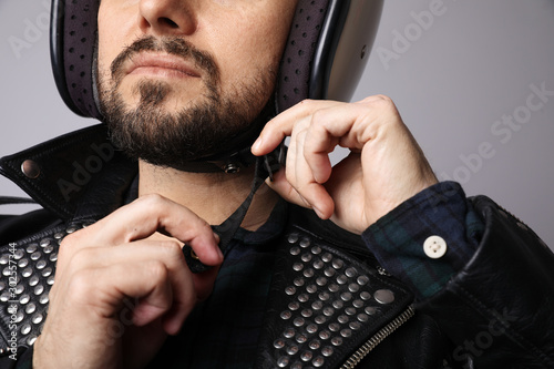 Close-up portrait of young biker with white helmet. Isolated.