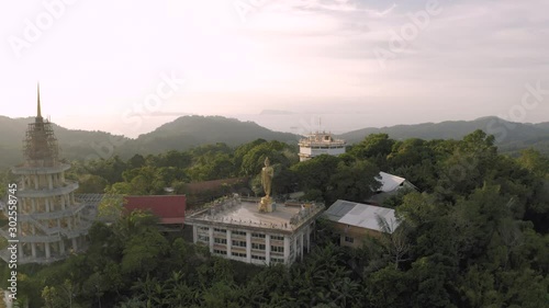 Gold Buddha statue on Samui Island miuntain, 4K Drone flight photo