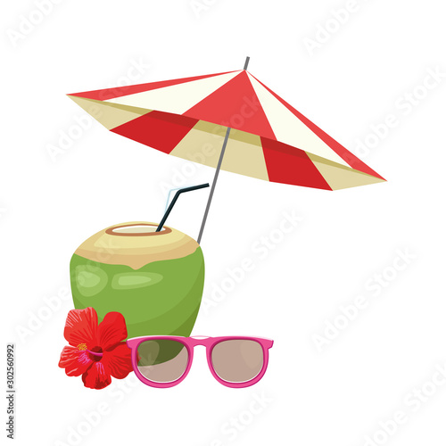 beach parasol with coconut drink and glasses