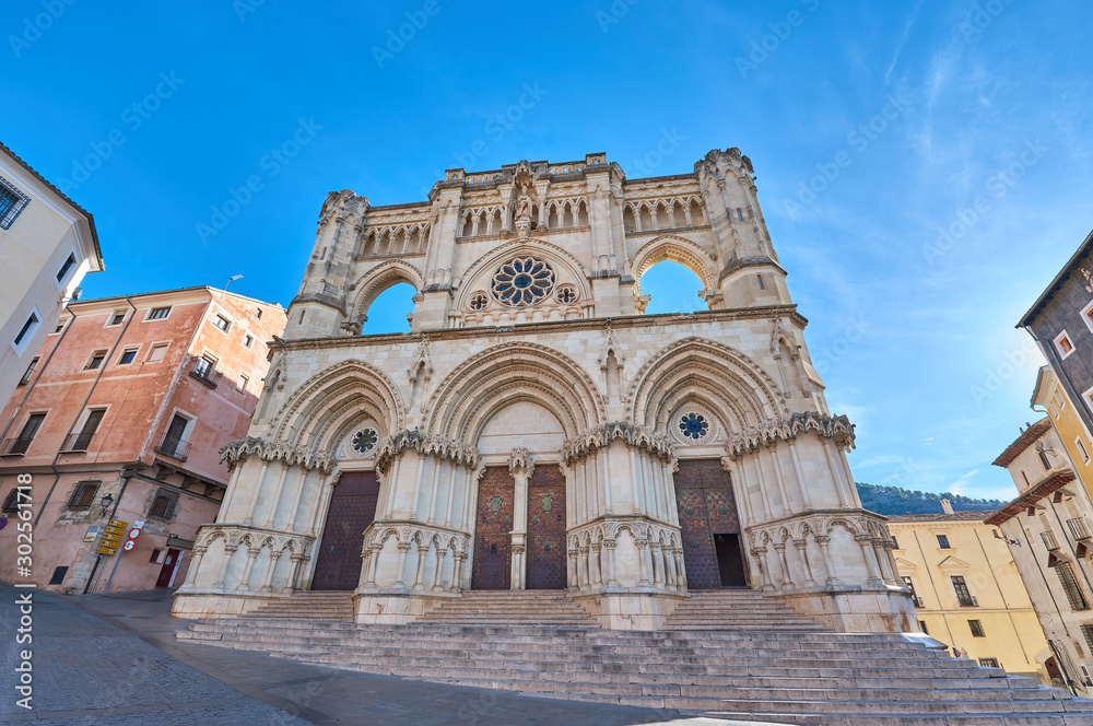 Foreground view of the facade of the gothic cathedral of Santa Maria and San Julian in the middle ages city of Cuenca, Castilla la Mancha, Spain