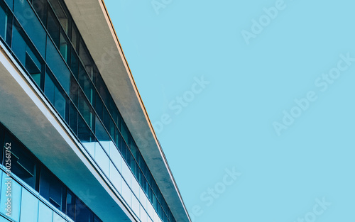 Business office Glass building architecture with Modern City. Urban corporate skyscraper exterior and skyline. Windows design. Blue sky on background. Cityscape with futuristic view concept