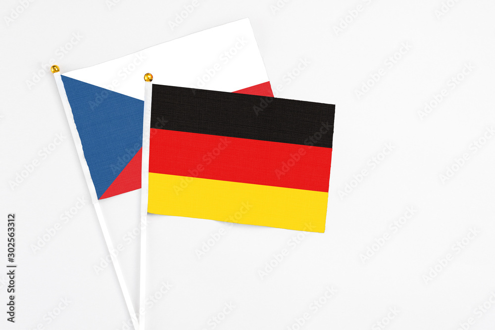 Germany and Cyprus stick flags on white background. High quality fabric, miniature national flag. Peaceful global concept.White floor for copy space. Germany and Cyprus stick flags on white background. High quality fabric, miniature national flag. Peaceful global concept.White floor for copy space.