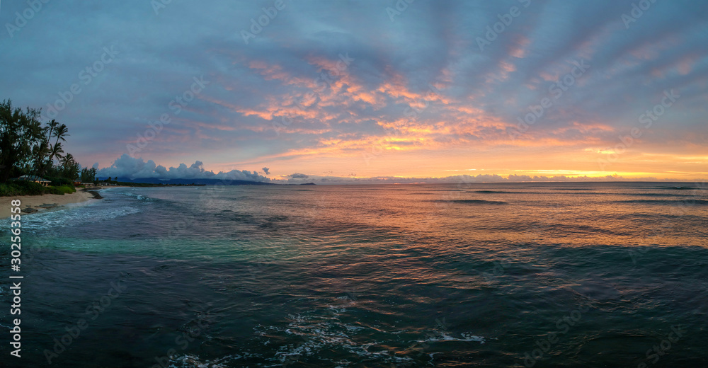 Aerial Panorama at a Beach in Hawaii in the Morning - Looking out to the Ocean, with a Vibrant Sunrise in the Sky