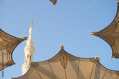 Big umbrella structure of al masjid al nabawi from the holy land and beautiful building structure madinah saudi arabia photo