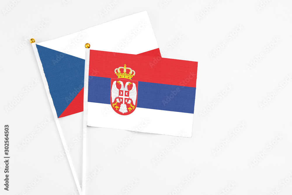 Serbia and Cyprus stick flags on white background. High quality fabric, miniature national flag. Peaceful global concept.White floor for copy space. Serbia and Cyprus stick flags on white background. High quality fabric, miniature national flag. Peaceful global concept.White floor for copy space.