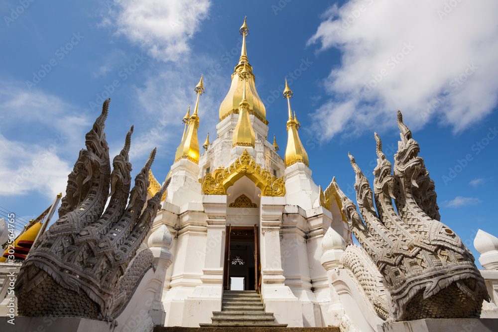 Golden and white pagoda at Wat Tham Khuha Sawan Temple, Ubon Ratchathani province, Thailand