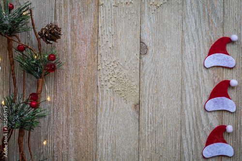 Holiday Christmas Winter concept with ornaments on wooden board, flat lay, text copy space