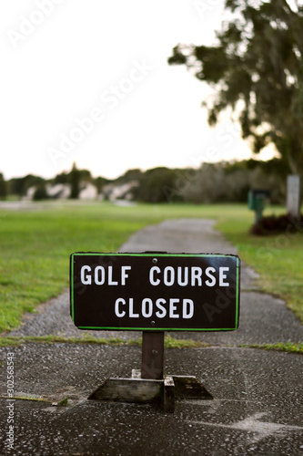Golf Course Closed Sign on Street