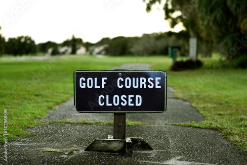 Golf Course Closed Sign on Street