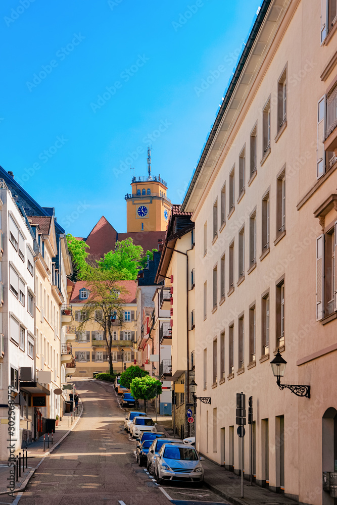 Cityscape with Street at Old city of Baden Baden at Baden Wurttemberg in Germany. View of building architecture and cars parked along road at Bath and spa German town in Europe. Landmark in summer.