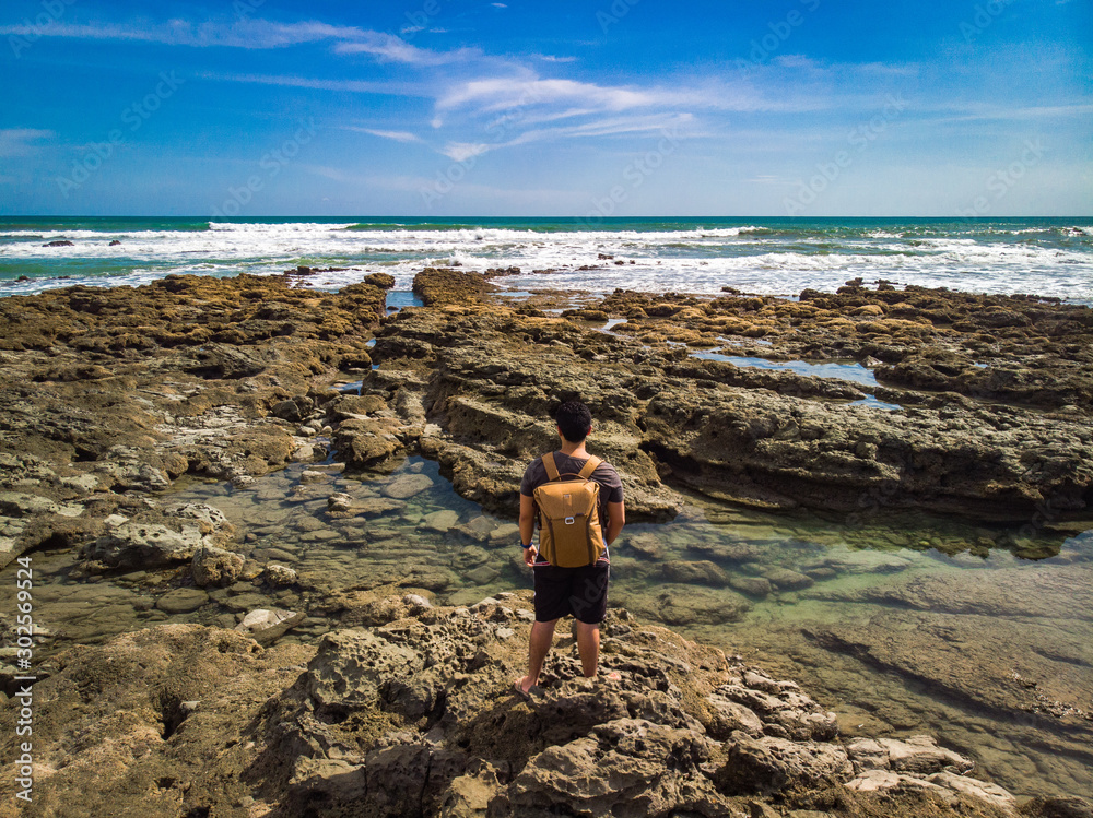 Man staring at the sea in Santa Teresa, Costa Rica
