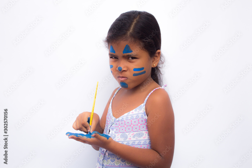 beautiful girl grimacing with her hands in the paint beautiful girl grimacing with her hands in the paint
