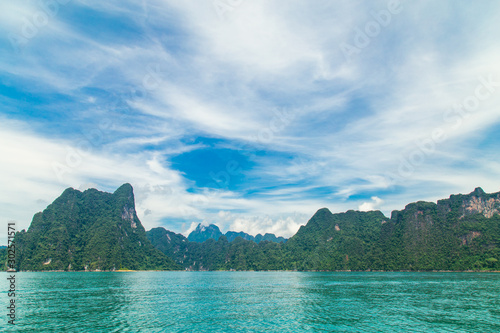 mountains lake river sky and natural attractions in Ratchaprapha Dam at Khao Sok National Park, Surat Thani Province, Thailand.