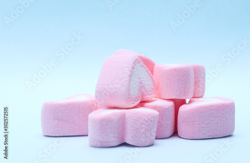 colorful marshmallows candy on blue background