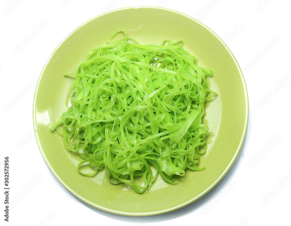 green noodles on dish isolated on white background