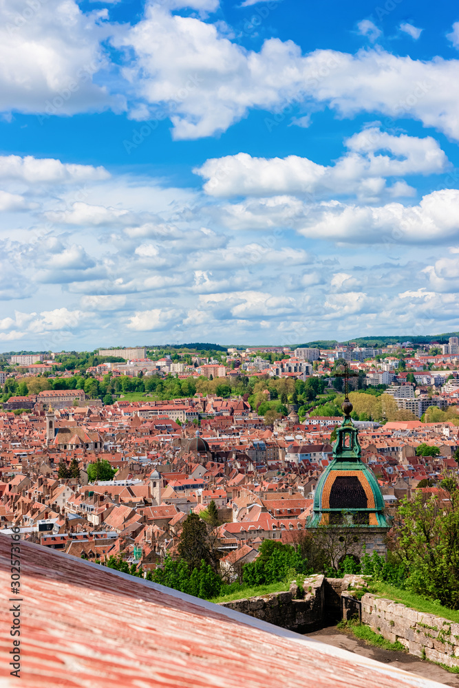 Cityscape and Cathedral from Citadel of Besancon in Bourgogne Franche-Comte region, France. Town roofs and Church seen from French Castle and medieval stone fortress in Burgundy.