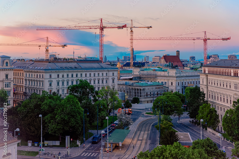 Skyline and cityscape on Museumstrasse in Vienna of Austria at sunset. Wien in Europe. Panorama. Street view. Building architecture landmark. In summer. Blue sky with clouds. Evening