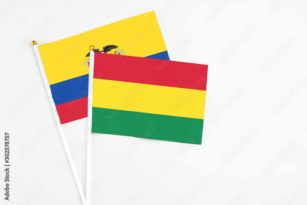 Bolivia and Ecuador stick flags on white background. High quality fabric, miniature national flag. Peaceful global concept.White floor for copy space. Bolivia and Ecuador stick flags on white background. High quality fabric, miniature national flag. Peaceful global concept.White floor for copy space.