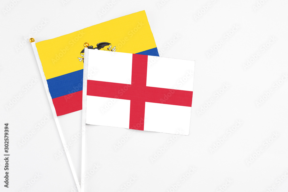 England and Ecuador stick flags on white background. High quality fabric, miniature national flag. Peaceful global concept.White floor for copy space.
