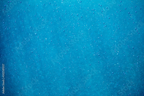 abstract blue and white bokeh and bubbles in the water