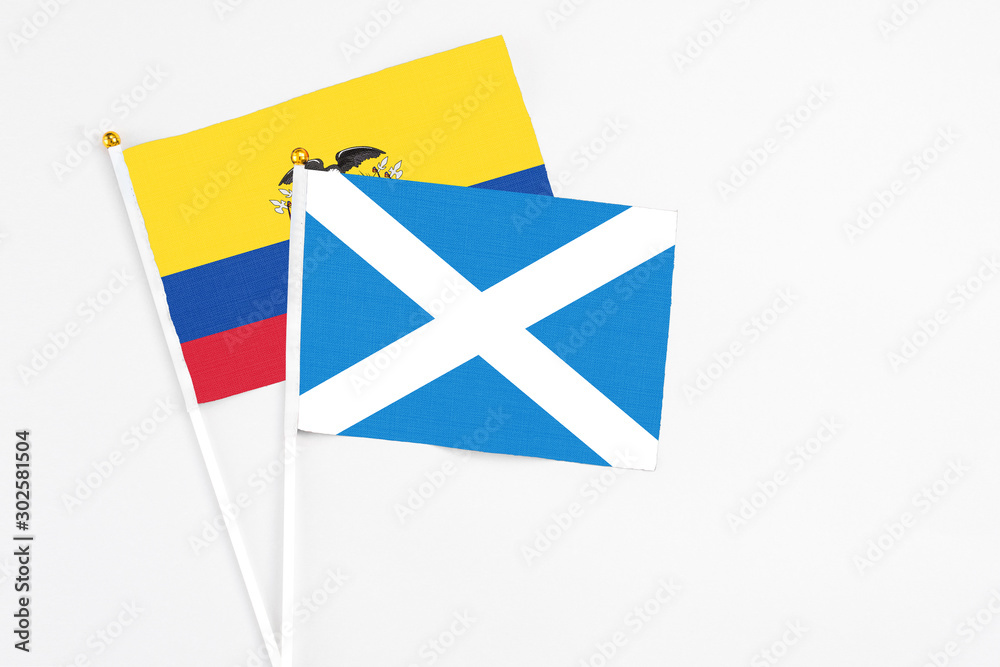 Scotland and Ecuador stick flags on white background. High quality fabric, miniature national flag. Peaceful global concept.White floor for copy space. Scotland and Ecuador stick flags on white background. High quality fabric, miniature national flag. Peaceful global concept.White floor for copy space.